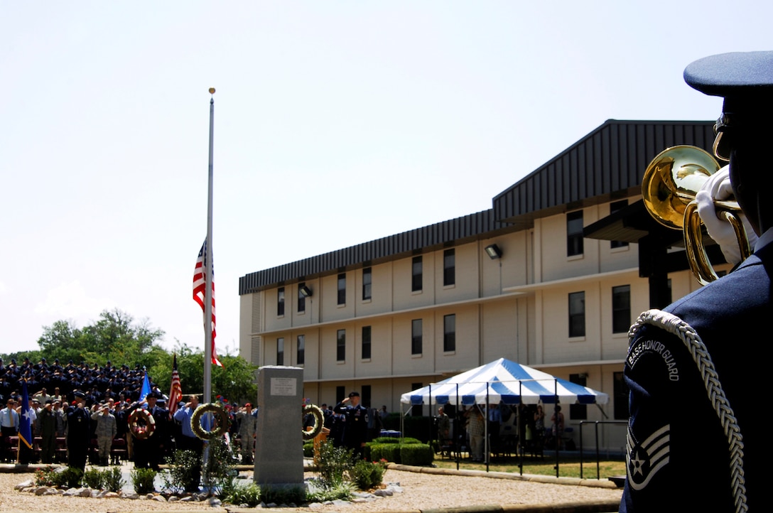 HURLBURT FIELD, Fla. --  A Hurlburt Field Honor Guard bugler plays taps during the Tactical Air Control Party memorial dedication June 26. (U.S. Air Force photo/Senior Airman Sheila DeVera)