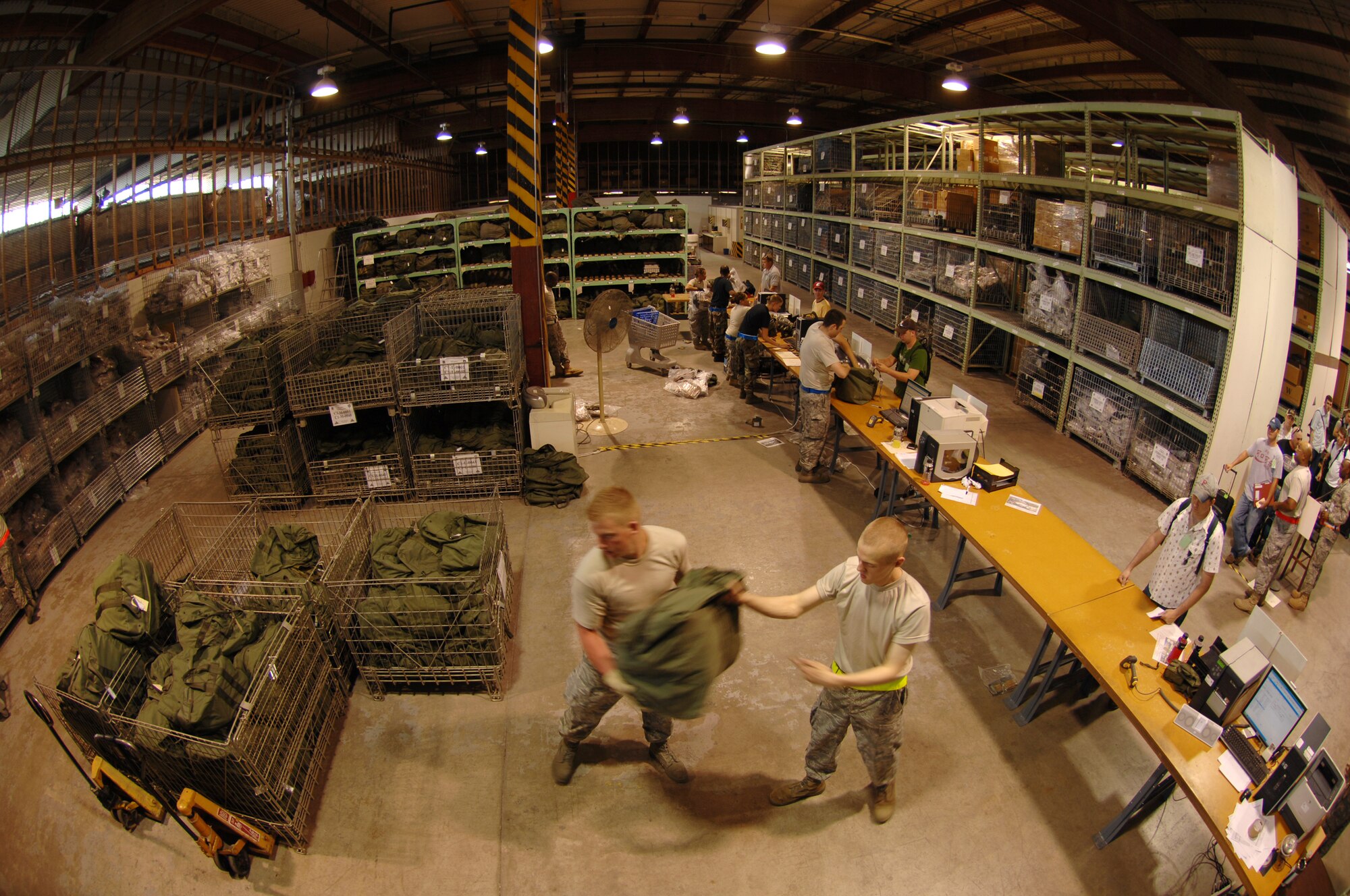 MCCONNELL AIR FORCE BASE, Kan., -- 22nd Logistics Readiness Squadron augmentees fill chemical warfare bags for members of Team McConnell June 28 prior to their deployment during the Nuclear Operational Readiness Exercise.