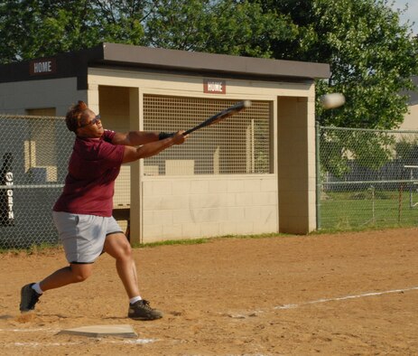 Gabriella Dillard, 436th Medical Group, hits a single during the second inning of the season opener Intramural Softball game June 29.  The 436th Communications Squadron defeated the 436th Medical Group 6-3.  (U.S. Air Force photo/Staff Sgt. Chad Padgett)