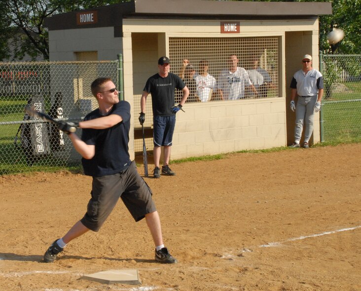 William Brown, 436th Communications Squadron, hits to center field during the first intramural softball game of the season June 29 against the 436th Medical Group.  The 436th CS defeated the 436th MDG 6-3.  (U.S. Air Force photo/Staff Sgt. Chad Padgett)