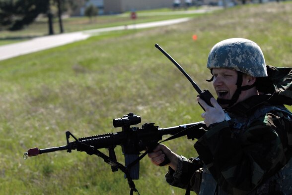Senior Airman Drew Cernick, 133rd Security Forces Squadron, calls to team members at an entry control point during Readiness Safeguard at Volk Field, Wis. May 16, 2009. Hundreds of men and women from the Minnesota Air National Guard unit joined others from Scott Air Force Base, Illinois for Readiness Safeguard in preparation for an Operational Readiness Inspection. USAF Official photo by Technical Sgt. Erik Gudmundson.(Released)