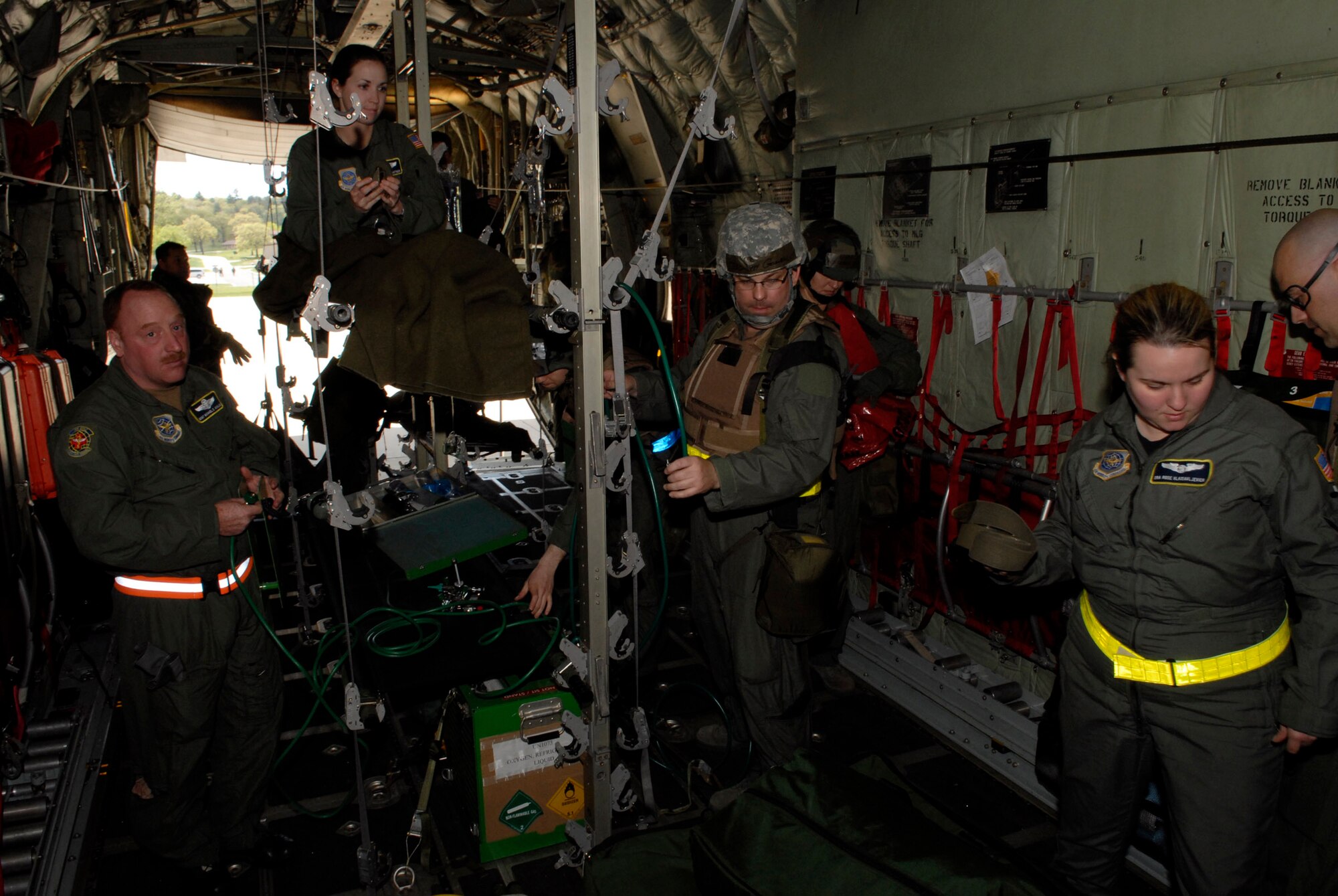 Within minutes, Airmen of the 109th Aeromedical Evacuation Squadron transformed the empty bay of a C-130 Hercules into a medical care facility capable of hauling wounded military members from the war zone to a hospital for treatment  during an exercise at Volk Field, Wis. on May 13, 2009. Hundreds of men and women from the Minnesota Air National Guard unit joined others from Scott Air Force Base, Illinois for Readiness Safeguard in preparation for an Operational Readiness Inspection. USAF Official photo by Technical Sgt. Erik Gudmundson.(Released)