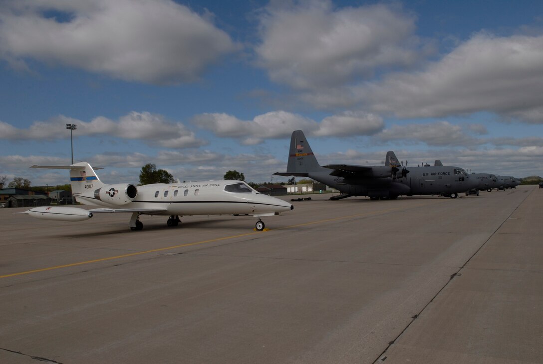 133rd Airlift Wing  C-130 "Hercules" are lined up next to a 375th Airlift Wing C-21 Learjet from Scott Air Force base. The C-21 is a twin turbofan engine aircraft used for cargo and passenger airlift. Both units are conducting training missions at Volk Field, Wis. on May 16, 2009. Hundreds of men and women from the Minnesota Air National Guard unit joined others from Scott Air Force Base, Illinois for Readiness Safeguard in preparation for an Operational Readiness Inspection. USAF Official photo by Technical Sgt. Erik Gudmundson.(Released)