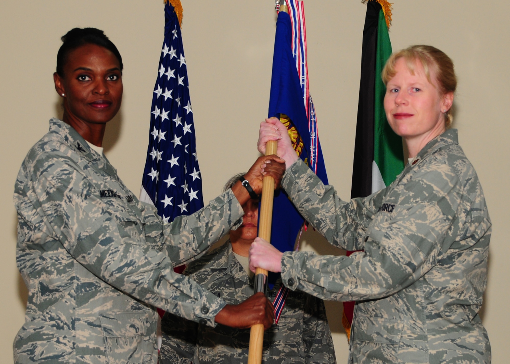 SOUTHWEST ASIA -- Maj. Jennifer Nevius recieves command of the 386th Expeditionary Force Support Squadron from Col. Marcia Meeks-Eure, 386th Expeditionary Mission Support Group commander, at an air base in Southwest Asia, June 29. (U.S. Air Force photo/Senior Airman Courtney Richardson)