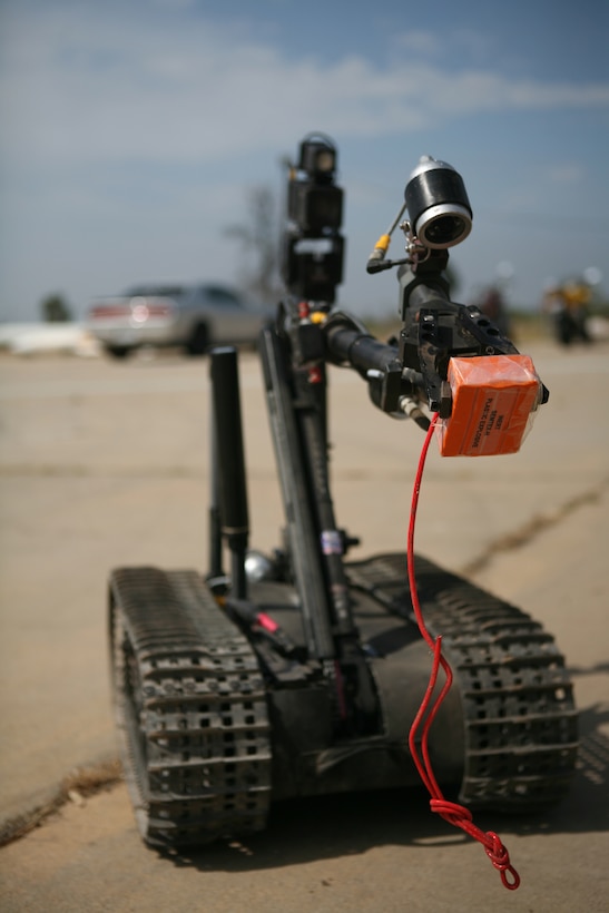 Staff Sgt. Mike Sadowski, an Explosive Ordnance Disposal technician, demonstrates the operations and functions of the man-transportable robot system "Talon 4" June 30. The Talon is an EOD robot used to identify, dispose of and detonate explosives.