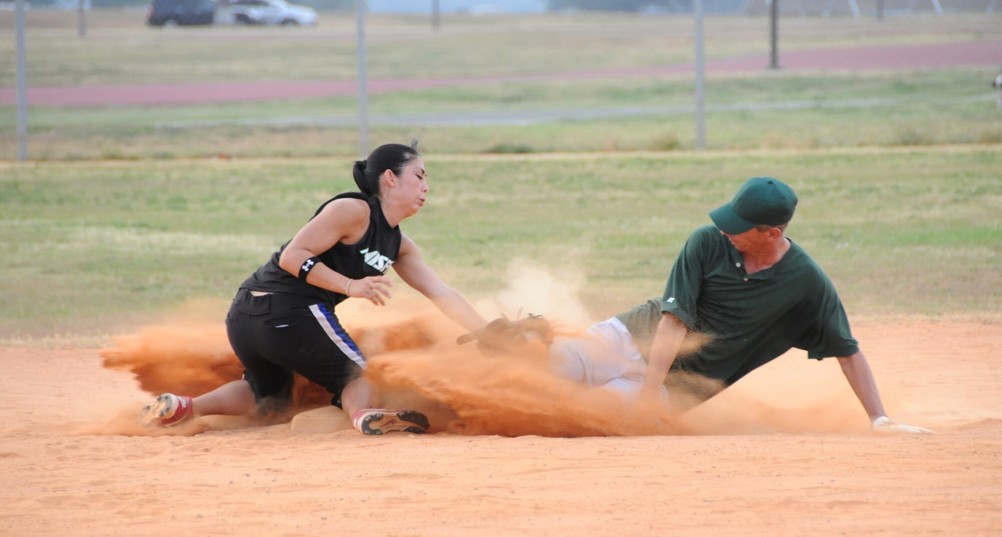Misfits second baseman Cynthia Hayes tags out Richard Fosnacht, 334th TRS, as he hustles in for the slide during the championship game, June 25.  (U.S. Air Force photo by Kemberly Groue)