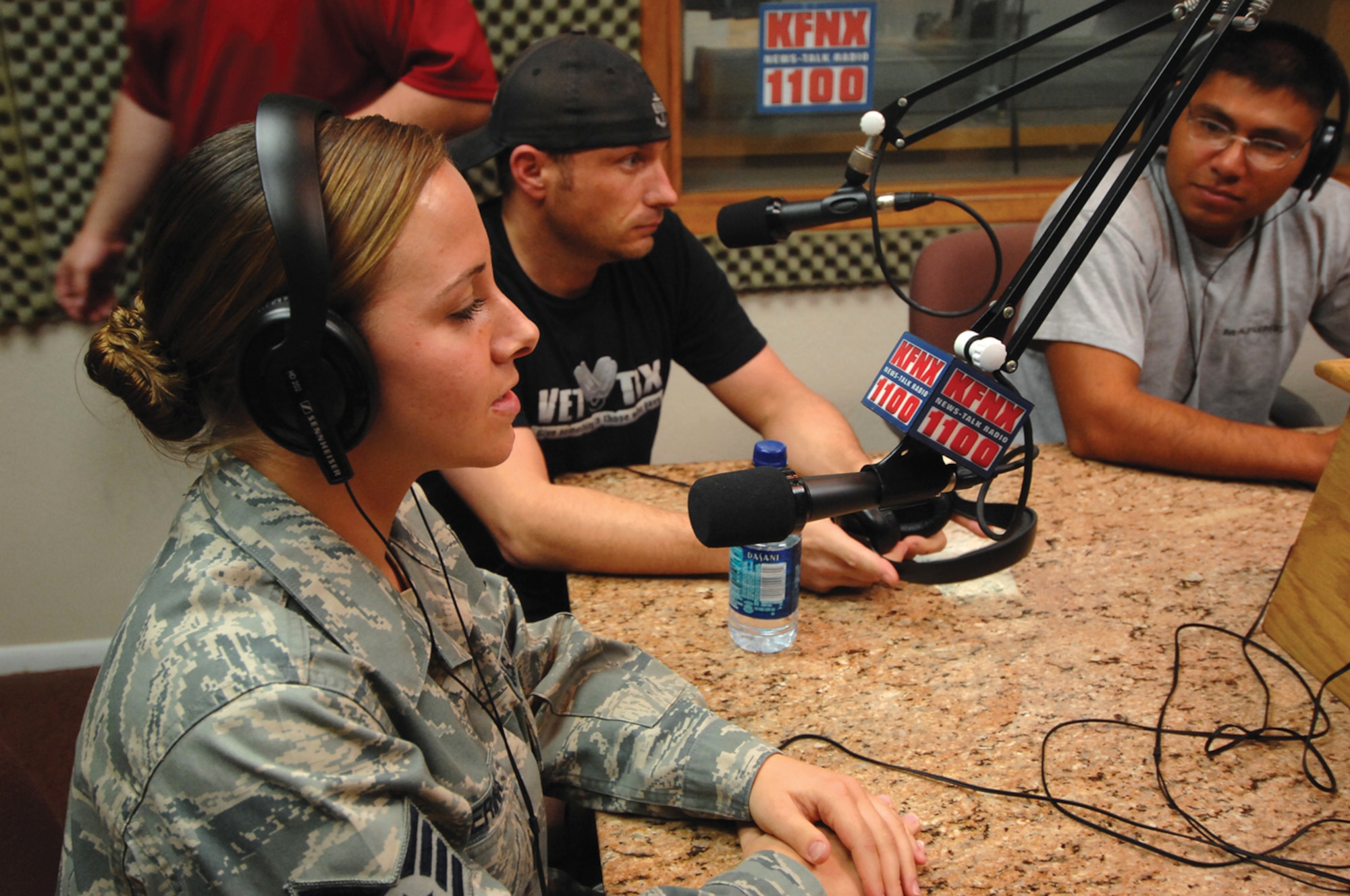 Staff Sgt. Yvonne Tijerina, 56th Logistic Readiness Squadron Vehicle Operations dispatch apprentice, prepares to be interviewed on an episode of “Main Street Out Loud” on local radio station KFNX AM. The episode featured one member of each of the four Defense Department branches, giving their first-hand perspectives on being deployed to Iraq. (U.S. Air Force photo/ Tech. Sgt. Jeffrey Wolfe)