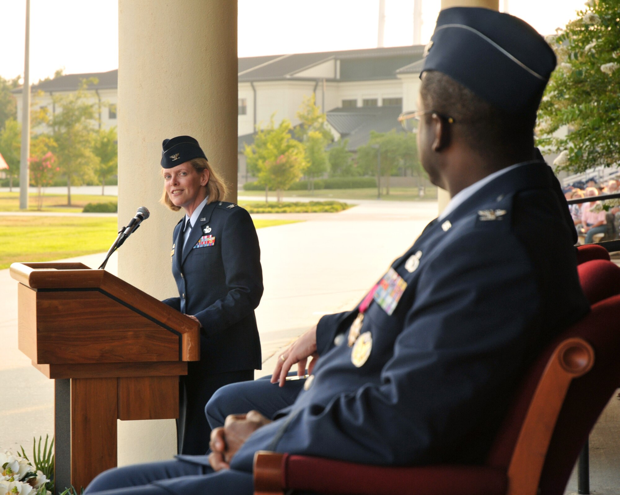Col. Lynn Connett, left, new commander of the 81st Training Group, recognizes her predecessor, Col.  Prince Gilliard Jr., at the change of command ceremony June 25.   She came to Keesler from the Pentagon, where she was chief of the Air Force Learning Division, Directorate of Force Development.  Colonel Gilliard is headed to the Pentagon to be the chair of the communications/information panel at Air Staff.  (U.S. Air Force photo by Adam Bond)