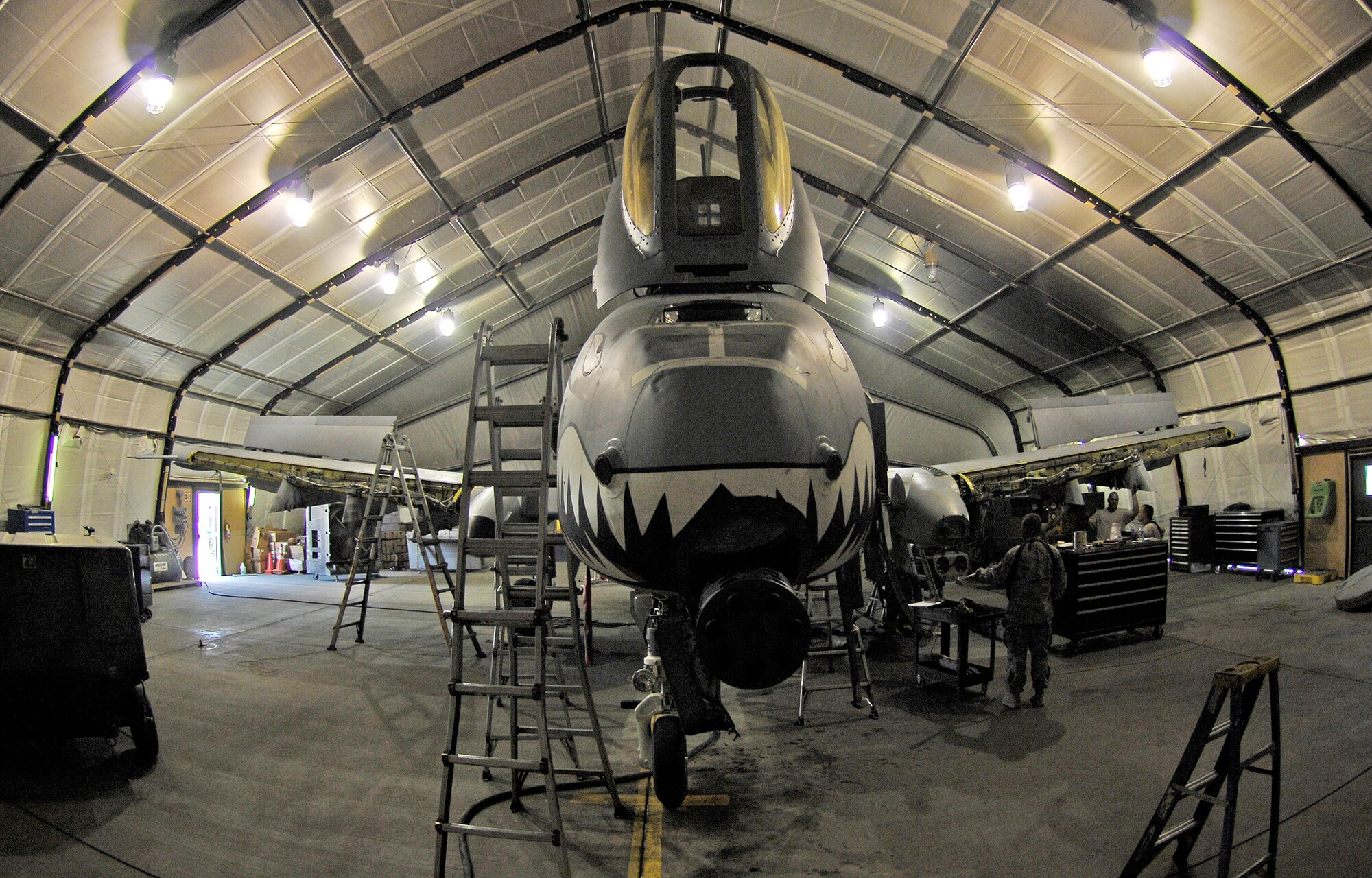 An A-10 Thunderbolt II sits in the 455th Expeditionary Maintenance Squadron hangar for a phase inspection July 2 at Bagram Airfield, Afghanistan. Maintainers here implemented a new phase inspection process that cuts maintenance time on the aircraft in half and ensures the aircraft can provide close air support for ground troops in Afghanistan. (U.S. Air Force photo/Staff Sgt. Jason Lake) 