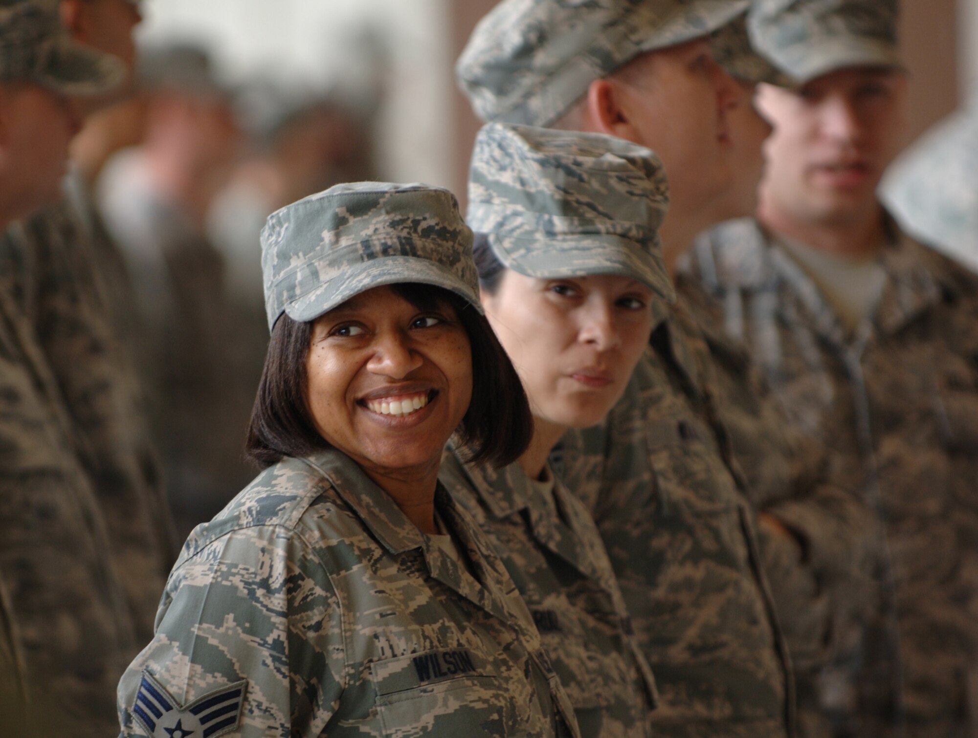 Senior Airman Tamara Wilson waits in formation with active-duty Airmen for the beginning of a change-of-command ceremony at McConnell Air Force Base, Kan. on July 2. Airman Wilson is a Reservist assigned to the 931st Aerospace Medicine Flight currently on active-duty orders with the 22nd Air Refueling Wing, the 931st's host unit at McConnell. (U.S. Air Force photo/Tech. Sgt. Jason Schaap)