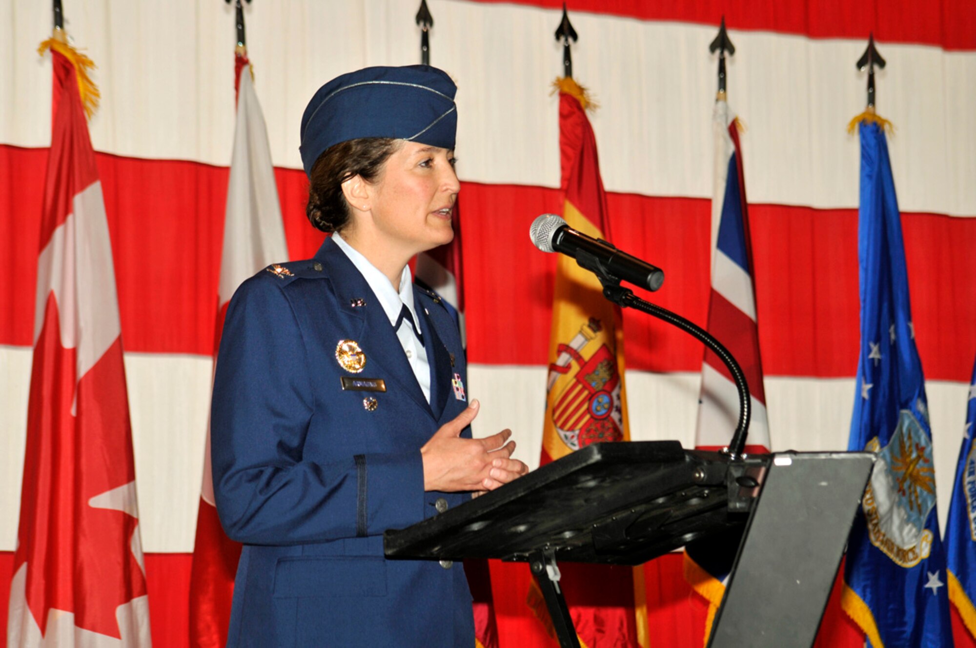 PETERSON AIR FORCE BASE, Colo. -- Col. Nina Armango assumed command of the 21st Operations Group June 22 in a ceremony held in Hangar 119. Colonel Armango comes to the group from the Office of the Secretary of Defense where she was the senior military assistant and chief of staff to the director of operational test and evaluation. She assumes command from Col. Chris Crawford who will now be assigned to the Joint Staff at the Pentagon. Col. Jay Raymond, 21st Space Wing commander, presided over the event. (Air Force photo by Larry Hulst) 