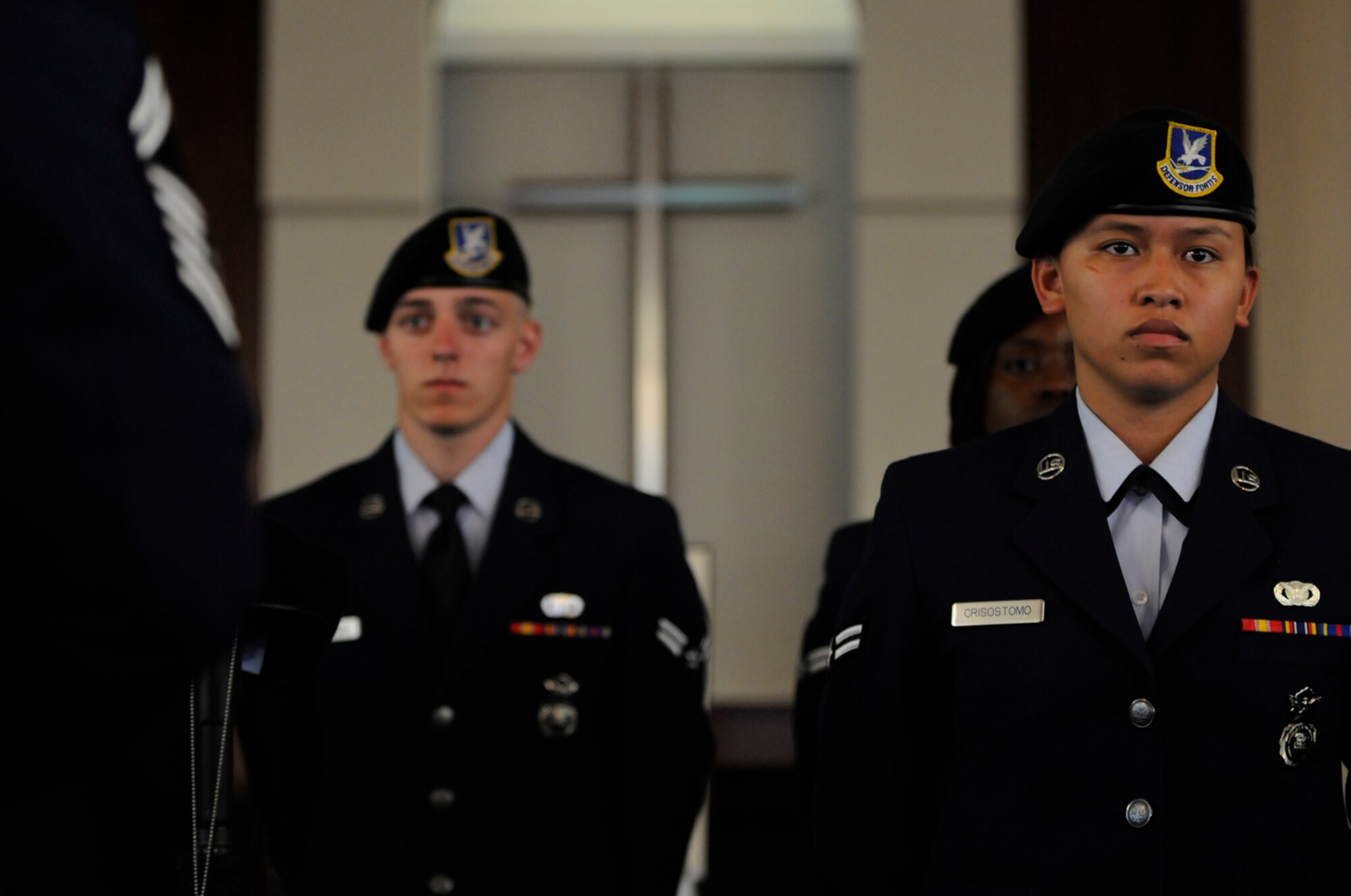 Airman 1st Class Tianna Crisostomo, 65th Security Forces Squadron, stands in the final guard mount formation during the memorial service for Senior Airman Amber Finnell, 65th SFS, at Lajes Field July 2. Airman Finnell was from East Tawas, Mich. and entered the Air Force in Feb. 2004.  She had been previously stationed at Minot AFB, N.D. and Sather AB, Baghdad, Iraq; she passed away on June 30, 2009.  (U.S. Air Force photo by Tech. Sgt. Darrell I. Dean)