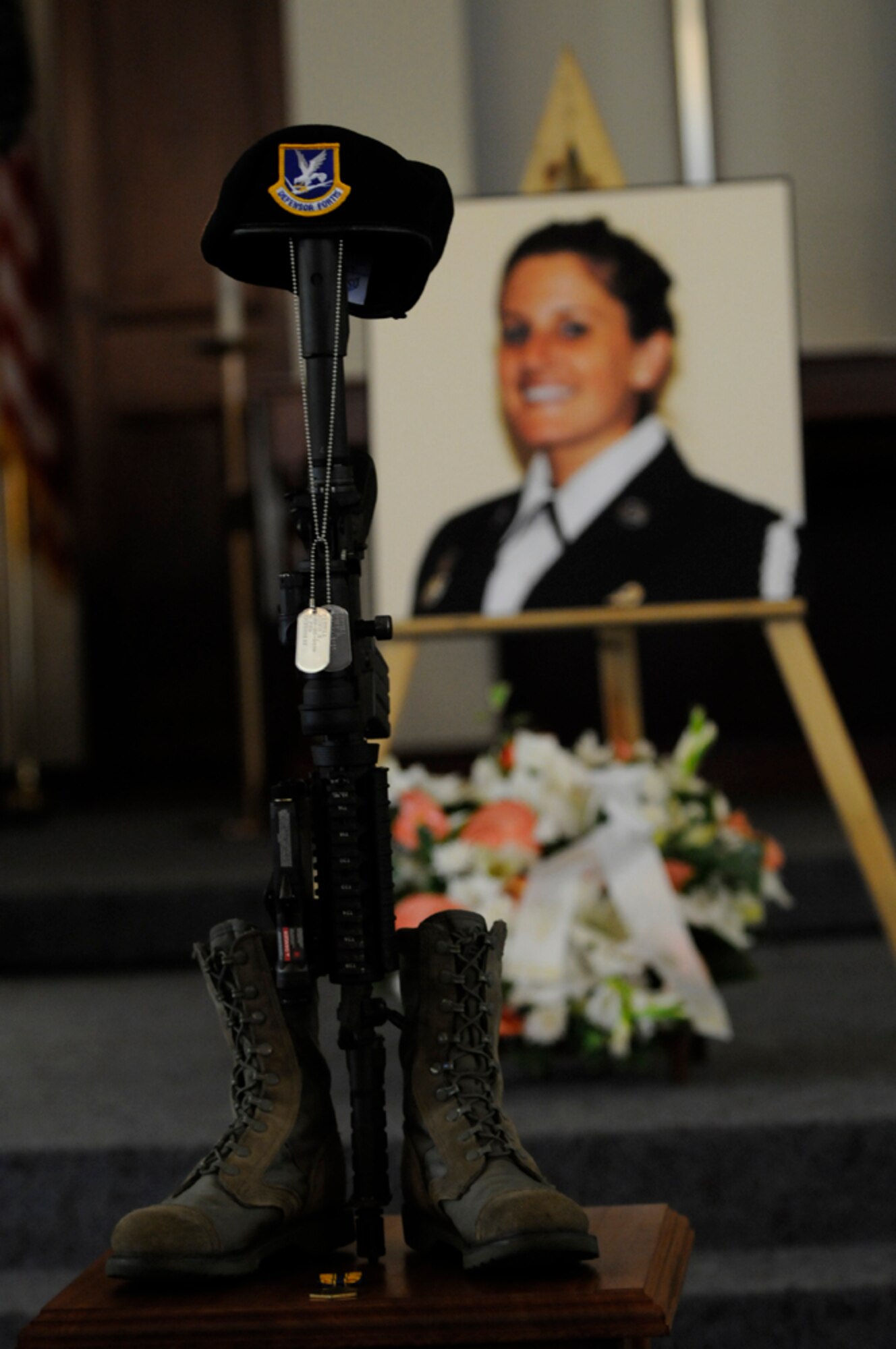 Members of the 65th Security Forces Squadron placed a memorial display in honor of Senior Airman Amber Finnell, 65th SFS, in the front of the base chapel sanctuary at Lajes Field July 2. Airman Finnell was from East Tawas, Mich. and entered the Air Force in Feb. 2004.  She had been previously stationed at Minot AFB, N.D. and Sather AB, Baghdad, Iraq; she passed away on June 30, 2009.  (U.S. Air Force photo by Tech. Sgt. Darrell I. Dean)