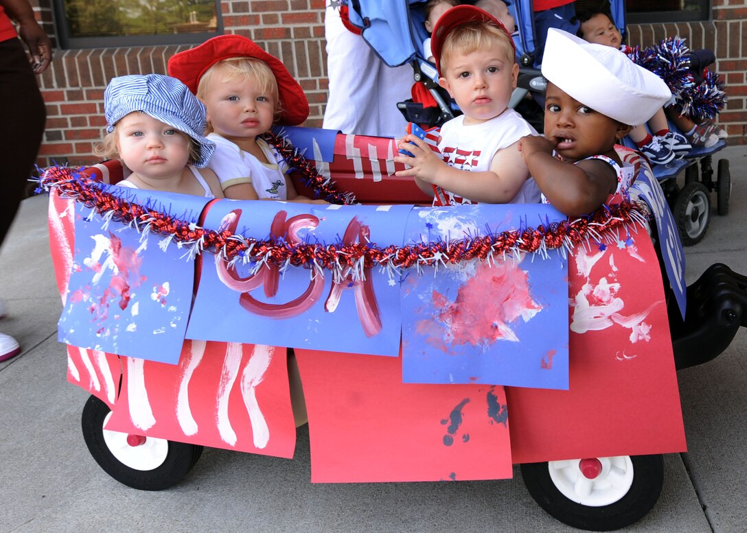 LANGLEY AIR FORCE BASE Va. -- Langley Child Development Center toddlers ride in a dressed up wagon here July 2. The children are participating in a 4th of July parade put on by the CDC employees to kick off the holiday weekend. (U.S. Air Force photo/Airman 1st Class Jonathan Koob)