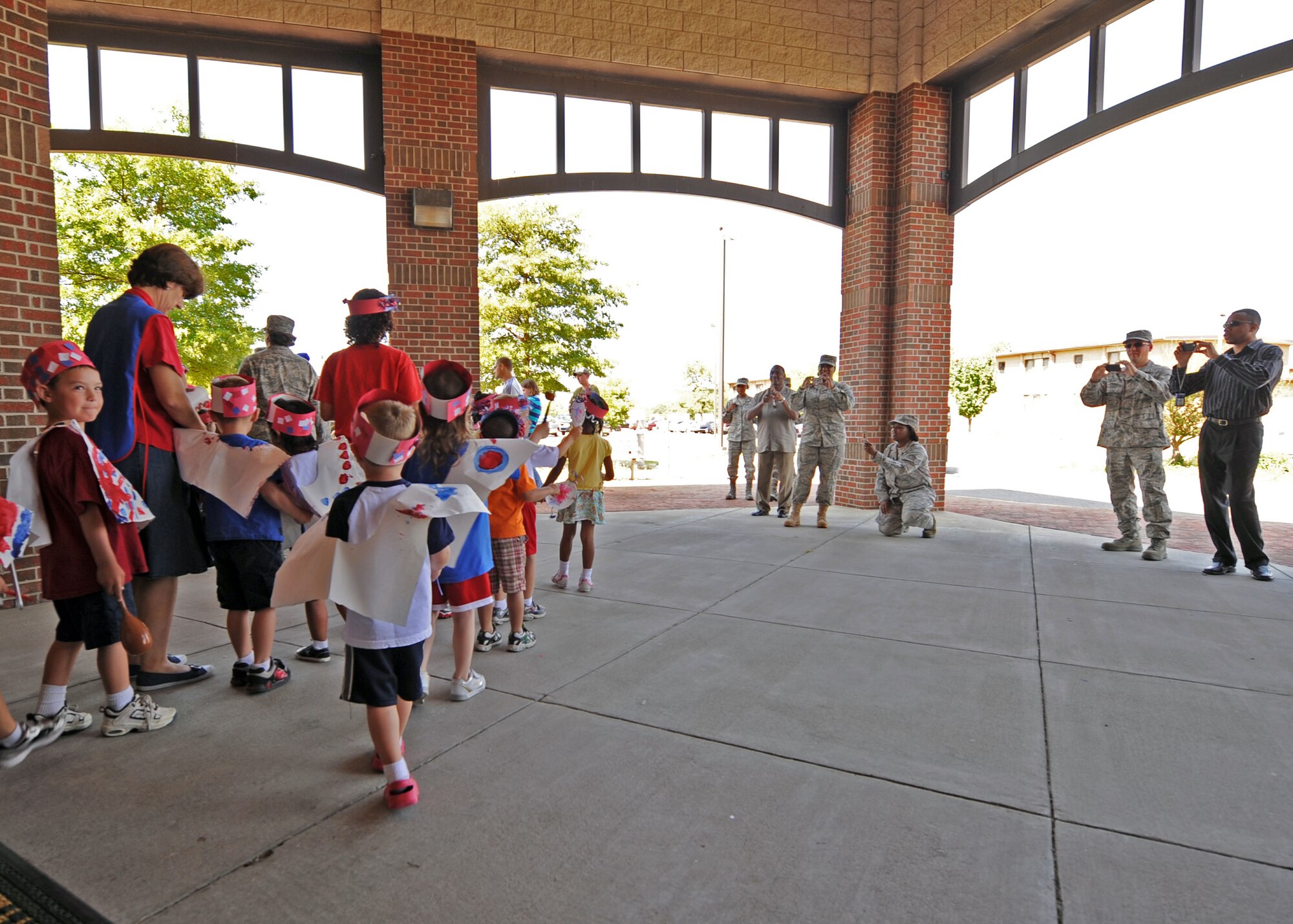 LANGLEY AIR FORCE BASE Va. -- A class of 3-5-year-olds at the Langley Child Development Center particpate in the CDC's 4th of July parade here July 2, to kick off the holiday weekend. (U.S. Air Force photo/Airman 1st Class Jonathan Koob)