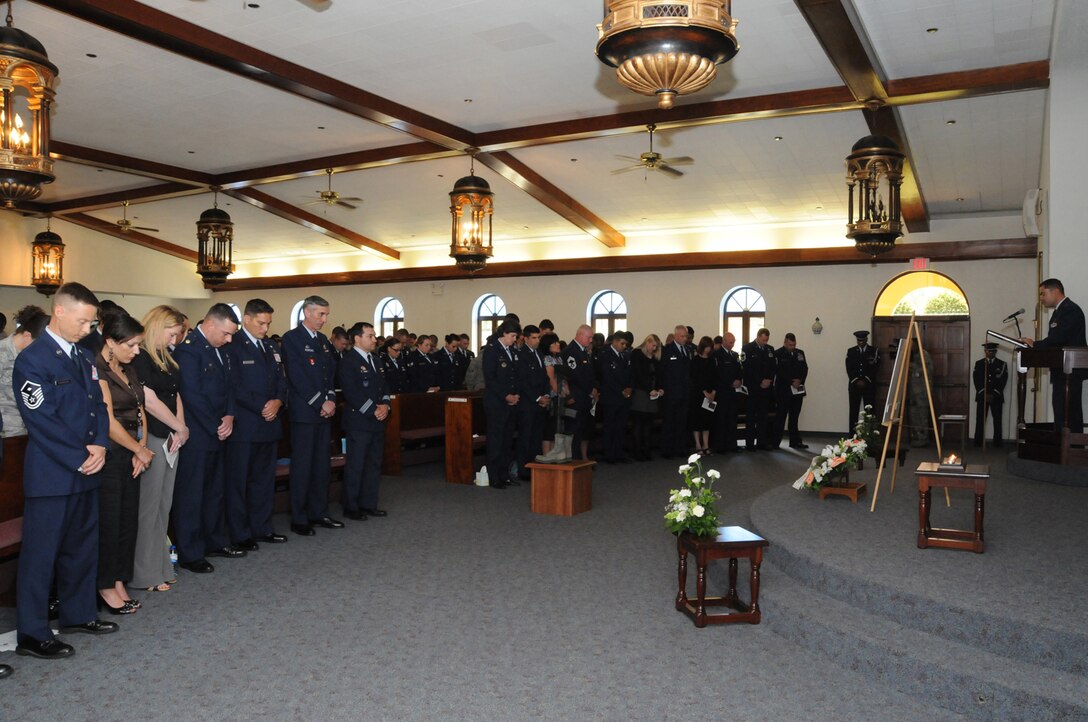 Members of the 65th Air Base Wing attend a memorial service in honor of Senior Airman Amber Finnell at Lajes Field July 2. Airman Finnell is from East Tawas, Mich. and entered the Air Force in Feb. 2004.  She had been previously stationed at Minot AFB, N.D. and Sather AB, Baghdad, Iraq; she passed away on June 30, 2009.  (U.S. Air Force photo by Tech Sgt. Rebecca F. Corey)