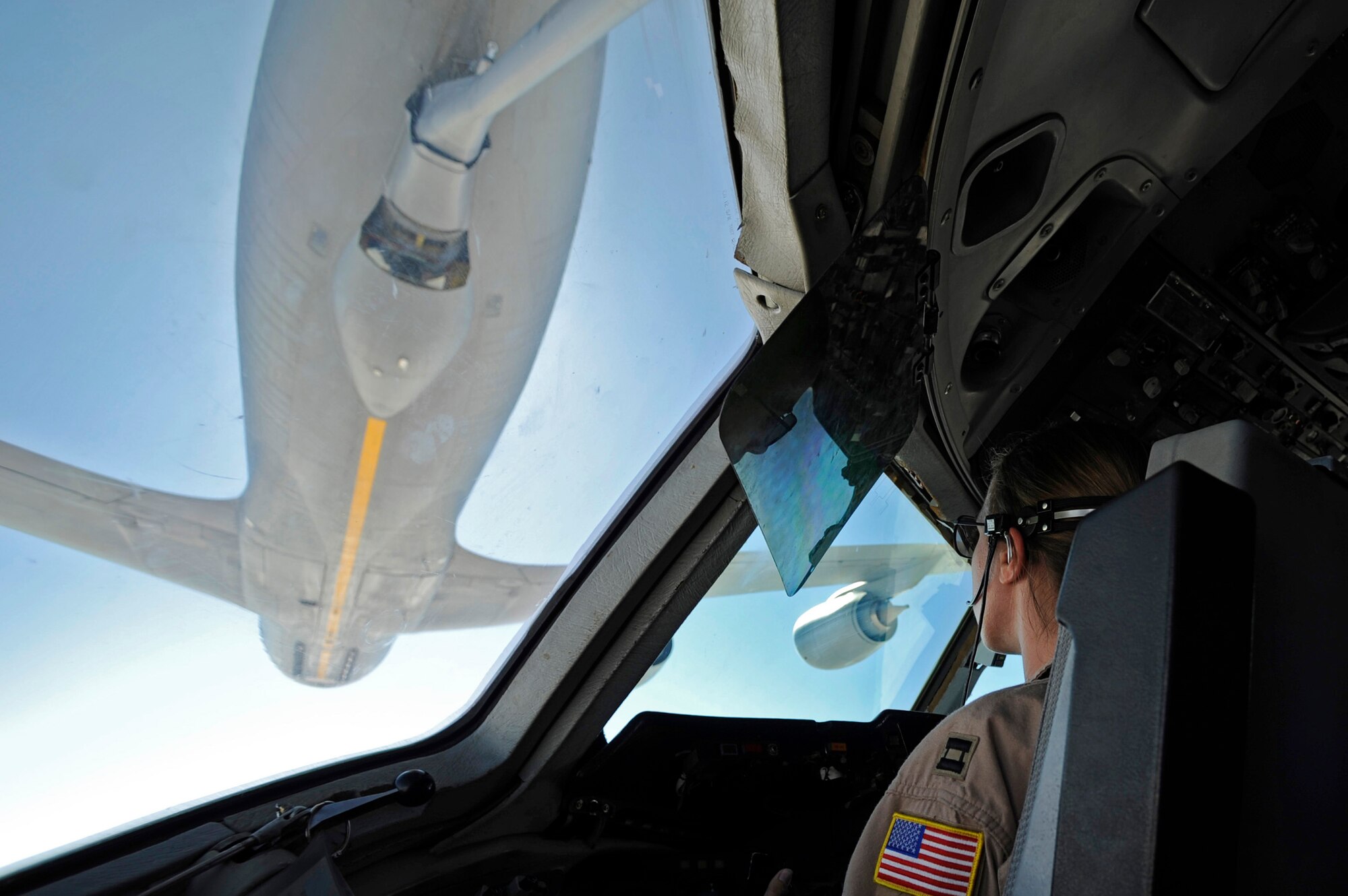 Capt. Kristin Sajevic pilots a KC-10 Extender while receiving fuel from an KC-135 Stratotanker June 14 over Afghanistan. Captain Sajevic is assigned to the 908th Expeditionary Air Refueling Squadron. (U.S. Air Force photo/Staff Sgt. Jason Robertson) 
