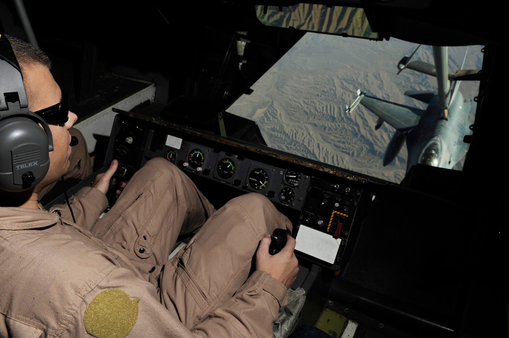 Staff Sgt. Justin Brundage refuels a Royal Netherlands air force F-16 from a KC-10 Extender June 18 over Afghanistan. Sergeant Brundage is a KC-10 boom operator from the 908th Expeditionary Air Refueling Squadron. (U.S. Air Force photo/Staff Sgt. Jason Robertson) 
