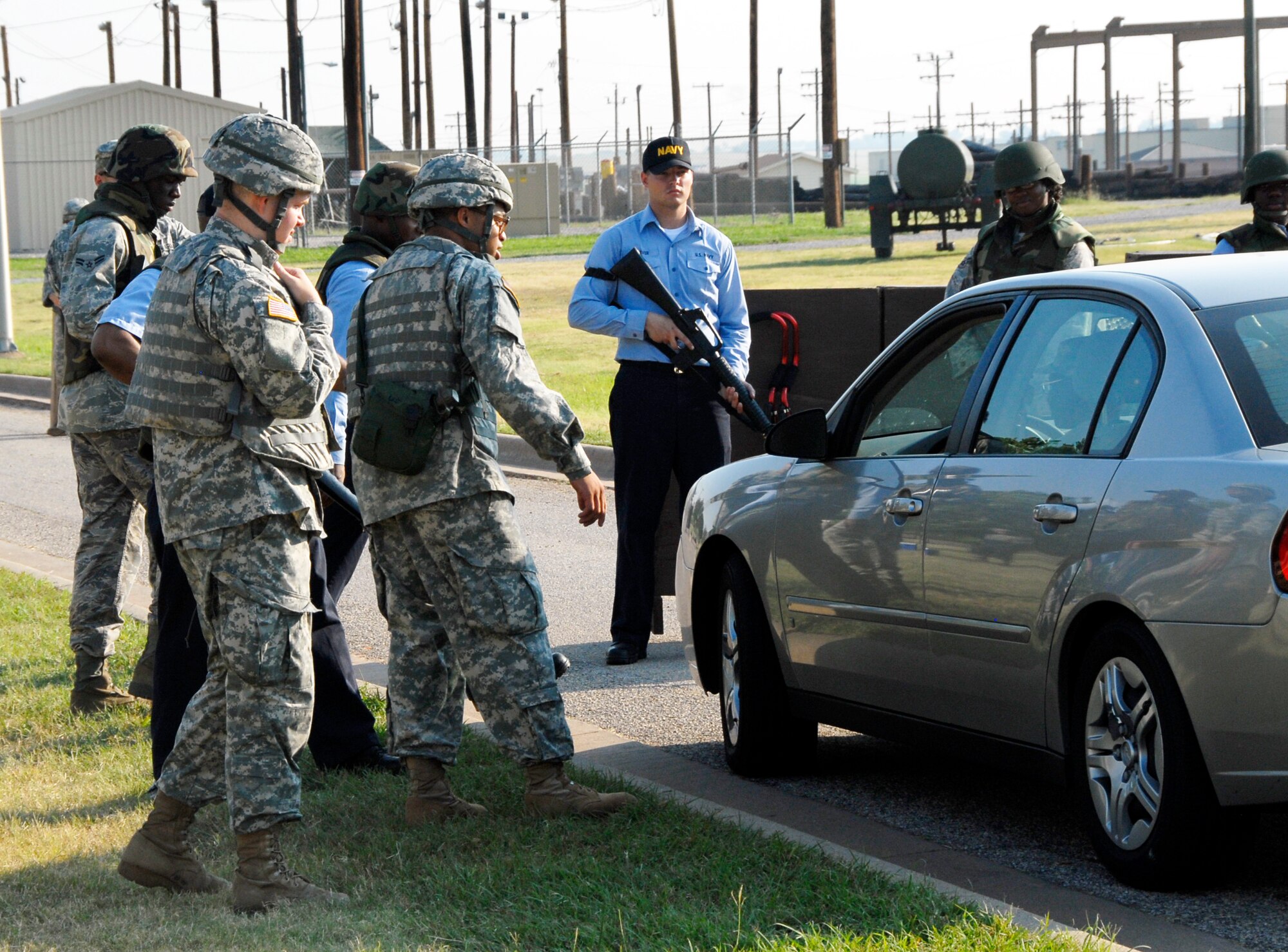 Soldiers, sailors and Airmen in Training of the 366th Training Squadron conduct joint combat training for their quarterly combat warrior weekend challenge June 27. The exercise combined combat training with technical training to prepare students for deployments. The squadron was the first in the 82nd Training Wing to have participation from its sister services during warrior weekend challenges. (U.S. Air Force photo/Harry Tonemah)