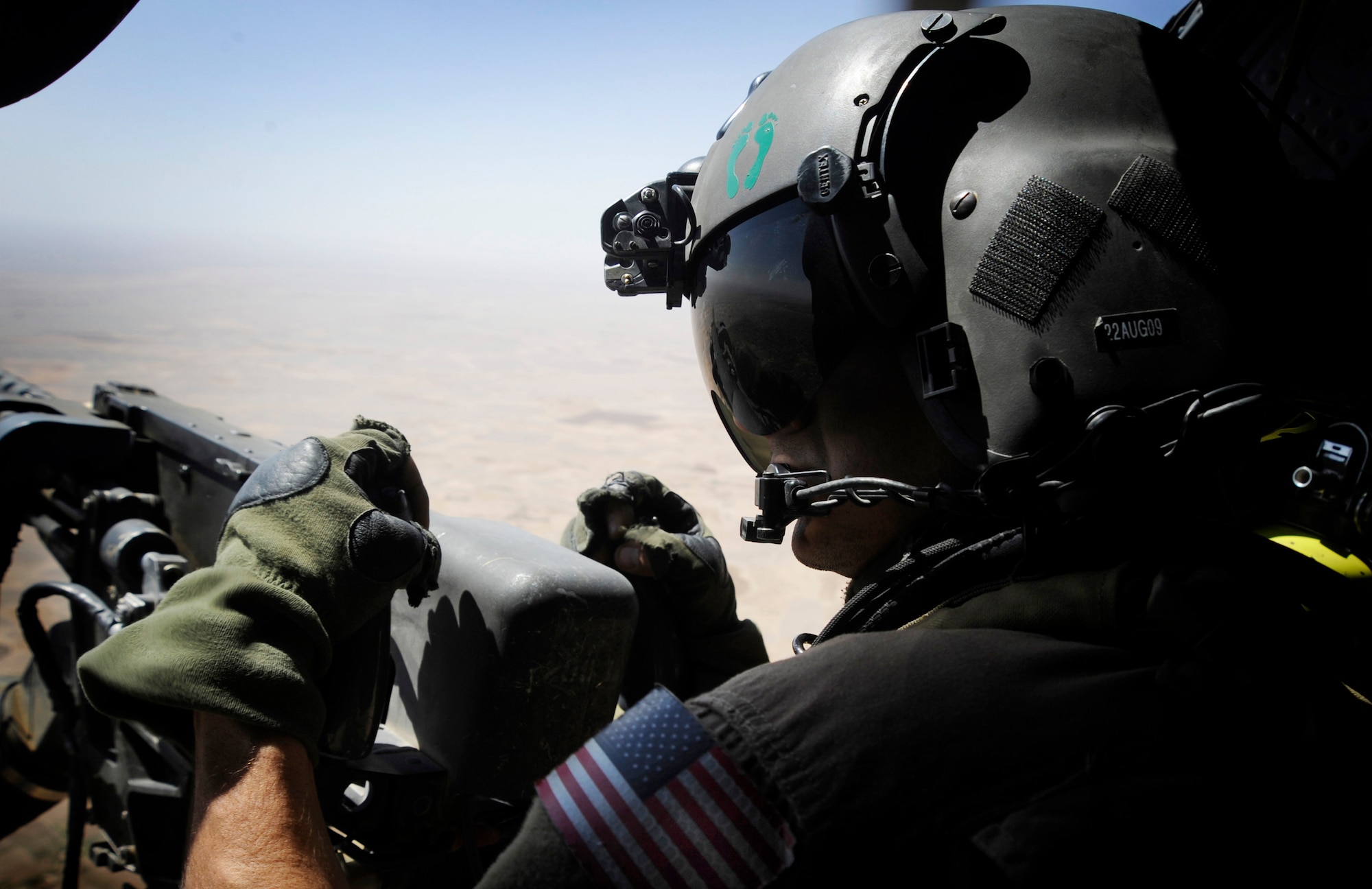 Staff Sgt. Sean Pellaton provides security during a medical evacuation mission June 26 over the Helmand Province, Afghanistan. Sergeant Pellaton is an aerial gunner with the 129th Expeditionary Rescue Squadron. (U.S. Air Force photo/Staff Sgt. Shawn Weismiller) 