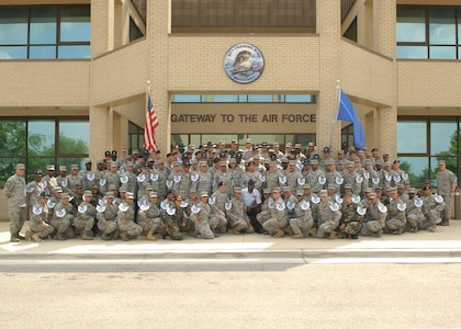 Team Lackland Airmen selected for promotion to technical sergeant pose for a group photo during the technical sergeant summit June 25. (U.S. Air Force photo/Alan Boedeker)