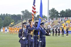 Combined 437th and 315th Airlift Wing honor guard members post the colors at the beginning of the Charleston Battery soccer game during the first of two military appreciation nights at Blackbaud Stadium June 25. The Charleston Battery professional soccer team traditionally holds two military appreciation nights during the year with the first one being in June and the second one in September. (U.S. Air Force photo/Staff Sgt. Marie Cassetty)(RELEASED)