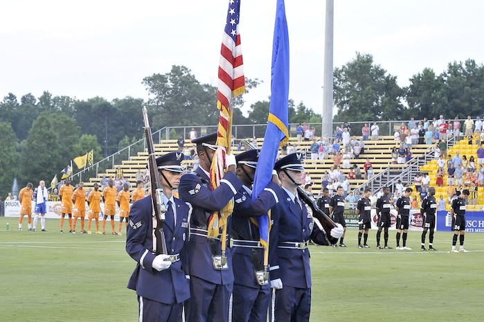 Combined 437th and 315th Airlift Wing honor guard members post the colors at the beginning of the Charleston Battery soccer game during the first of two military appreciation nights at Blackbaud Stadium June 25. The Charleston Battery professional soccer team traditionally holds two military appreciation nights during the year with the first one being in June and the second one in September. (U.S. Air Force photo/Staff Sgt. Marie Cassetty)(RELEASED)