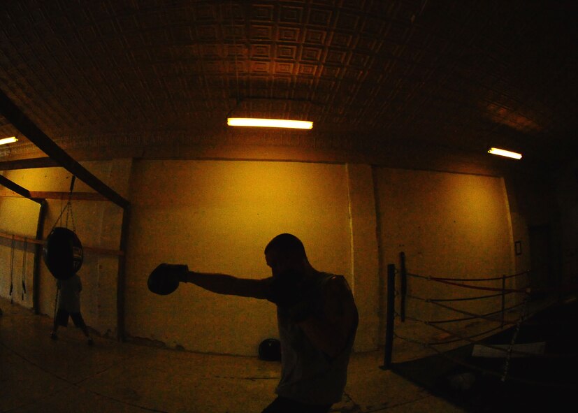 DYESS AIR FORCE BASE, Texas -- Senior Airman Kyle Jenkins, 317th Aircraft Maintenance Squadron instrument flight apprentice, warms up during his training program June 24 at the Abilene Boxing Club led by Tech. Sgt. Edward Reevis. Airman Jenkins has been training with Sergeant Reevis for about 2 years. (U.S. Air Force Photo by Airman 1st Class Stephen Reyes)