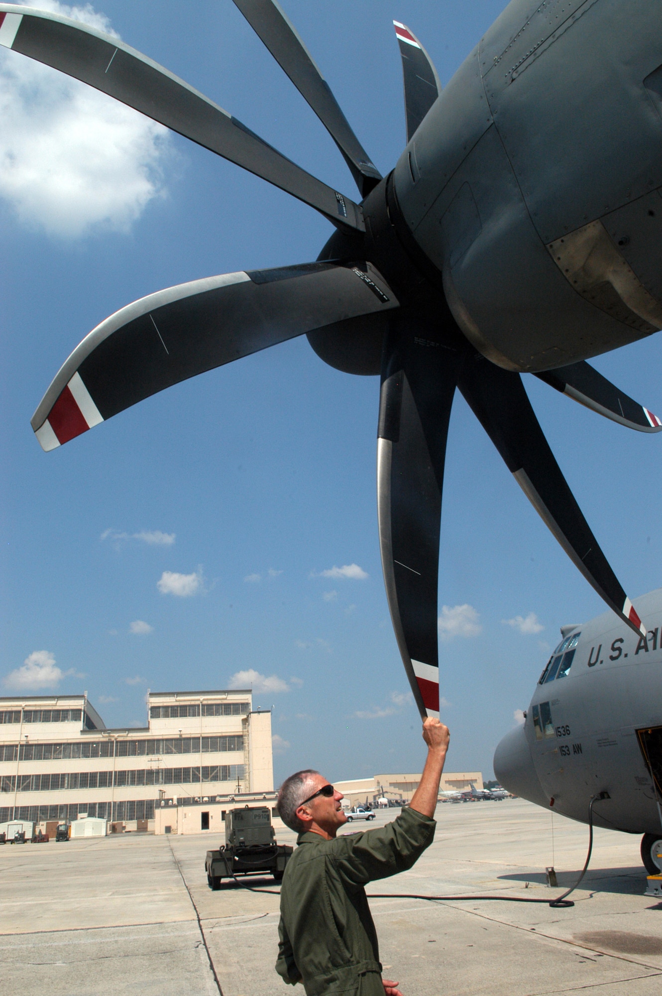 Col. Dennie Grunstad, 153rd Air Wing commander, talks about the improvement the 8 propellers make in the  capabilities of the C-130 H3. U. S. Air Force photo by Sue Sapp