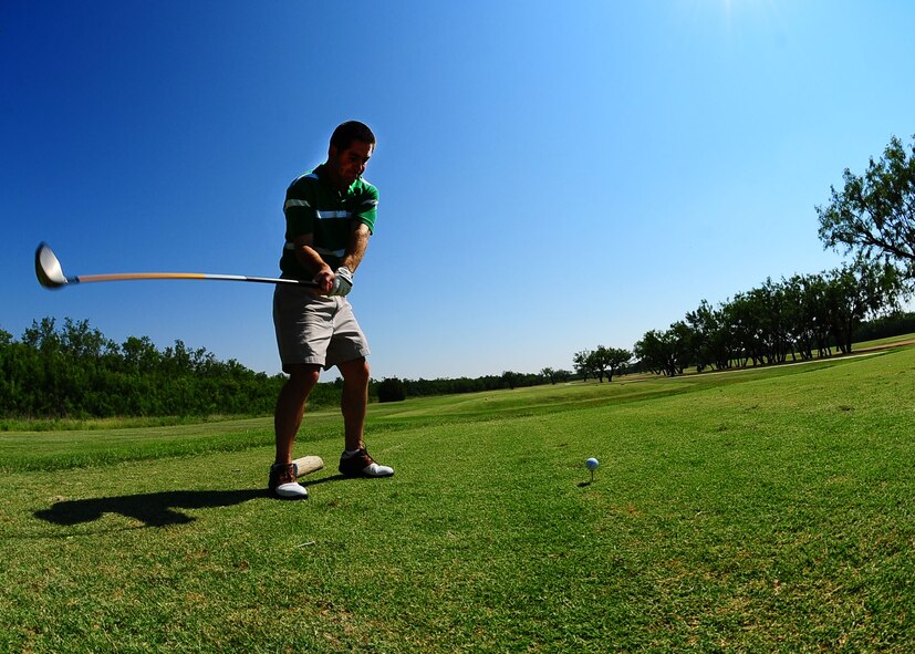 DYESS AIR FORCE BASE, Texas—Capt. Matthew Heineman, 7th Aerospace Medicine Squadron, tees off on the third hole June 26 during the Commander's Challenge at the Mesquite Grove Golf Course here. (U.S. Air Force Photo by Airman 1st Class Stephen Reyes)