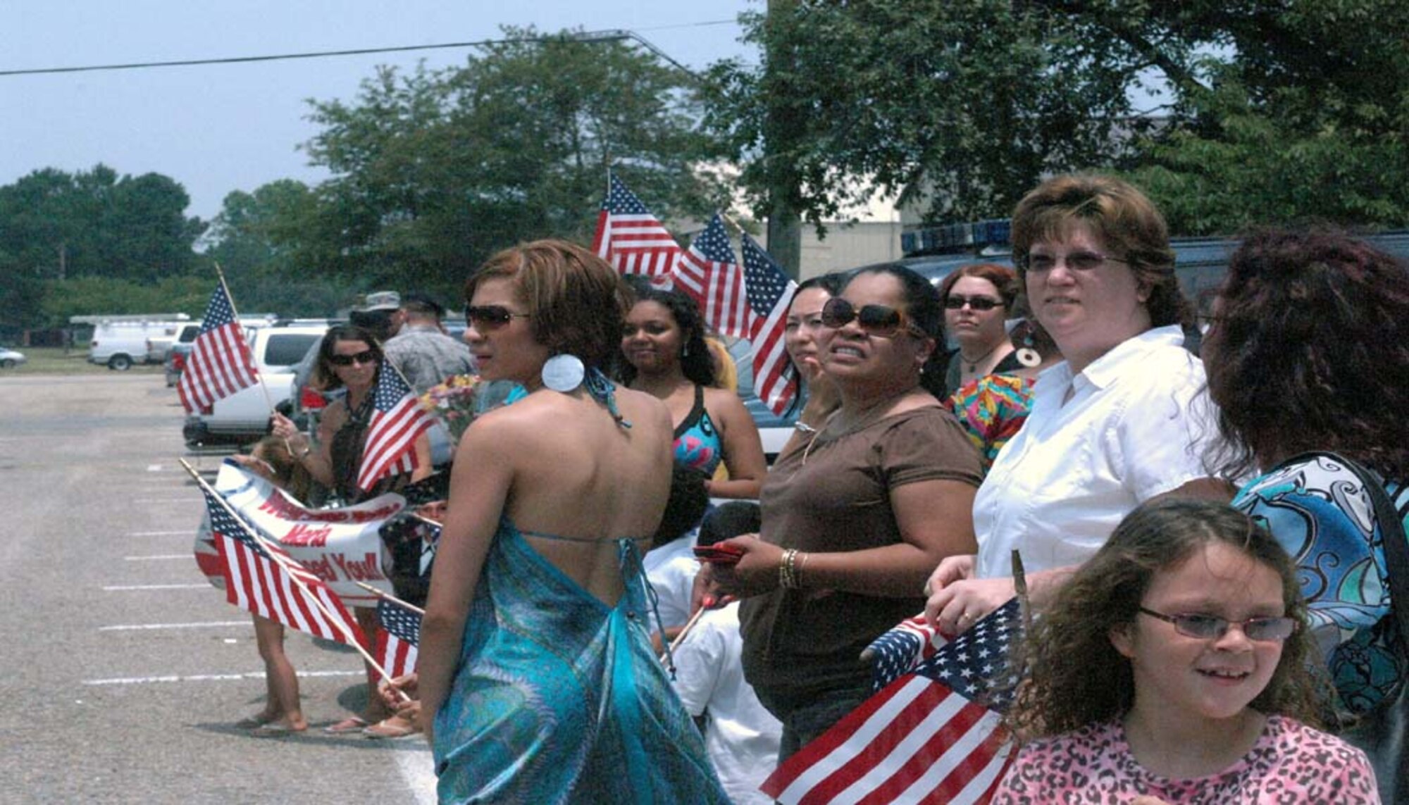 Family and friends wait anxiously for 4th Security Forces Squadron members returning from Iraq on Vermont Garrison Ave. at Seymour Johnson Air Force Base, N.C., June 26, 2009. The 43 defenders were part of the 332nd Expeditionary Security Forces Group, who is in charge of base defense and protection at Joint Base Balad, Iraq, since July 2008. (U.S. Air Force photo by Airman 1st Class Marissa Tucker)
