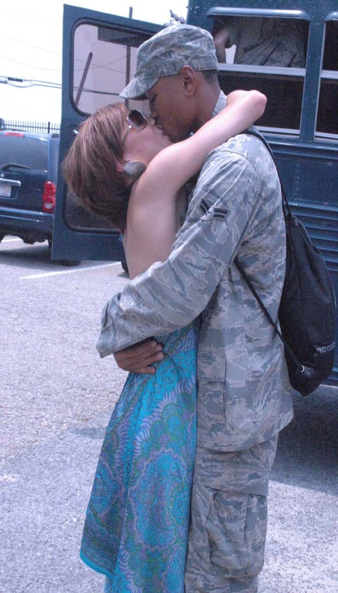 Airman 1st Class Tyrone Stewart, 4th Security Forces Squadron, kisses his wife, Linmary, at his return celebration at Seymour Johnson Air Force Base, N.C. June 26, 2009. Airman Stewart manned entry control points and maintained base security for seven months at Joint Base Balad, Iraq. (U.S. Air Force photo by Airman 1st Class Marissa Tucker)