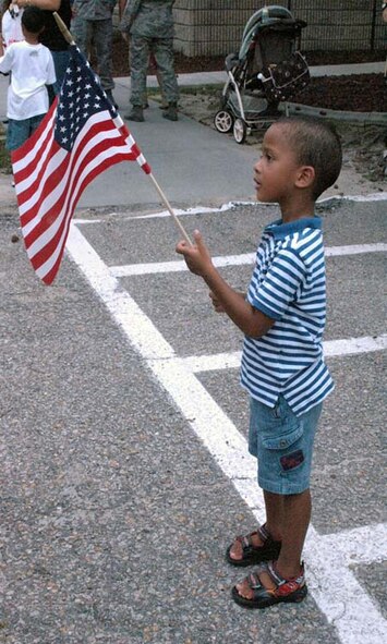 Elijah Thomas, 4, waits for his father, Staff Sgt. Dacota Thomas, 4th Security Forces Squadron, to return from a deployment June 26, 2009 at Seymour Johnson Air Force Base, N.C.  Forty-three defenders returned from Iraq after deployments ranging from six to nine months. (U.S. Air Force photo by Airman 1st Class Marissa Tucker)
