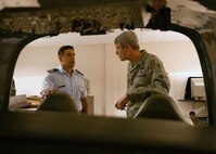 Capt. Eber Chanquia, an Inter-American Air Forces Academy guest instructor from Argentina, talks with Air Force Chief of Staff Gen. Norton Schwartz about the flight simulators used in the Pilot Instrument Procedures course. Students at IAAFA attend a myriad of courses ranging from aircraft and systems maintenance to instrument pilot training, to professional military education. Approximately 800 students from 21 countries graduate from the academy each year. (U.S. Air Force photo/Robbin Cresswell)