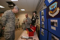 Master Sgt. Enrique Corral talks to Air Force Chief of Staff Gen. Norton Schwartz about the Inter-American Air Forces Academy's security forces ground defense course June 26. Students at IAAFA attend a myriad of courses ranging from aircraft and systems maintenance to instrument pilot training, to professional military education. Approximately 800 students from 21 countries graduate from the academy each year. Sergeant Corral is with the 318th Training Squadron. (U.S. Air Force photo/Robbin Cresswell)
