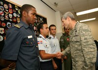 Air Force Chief of Staff Gen. Norton Schwartz meets with Defense Language Institute English Language Center students during his visit to Lackland June 26. From left to right, the students are Lt. Michael Onalaja, Nigeria; Lt. Juan Pina Duluc, Dominican Republic; and Lts. Emre Vuran and Unal Karahan, Turkey. (U.S. Air Force photo/Robbin Cresswell)