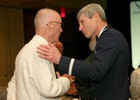Air Force Chief of Staff Gen. Norton Schwartz talks with retired Lt. Gen. (Dr.) Paul W. Myers, a former Air Force surgeon general, during a dinner ceremony in downtown San Antonio June 25. The event marked the 60th anniversary of the Air Force medical service and included recognition of medical service personnel in attendance who had been injured in the line of duty. (U.S. Air Force photo/Robbin Cresswell)
