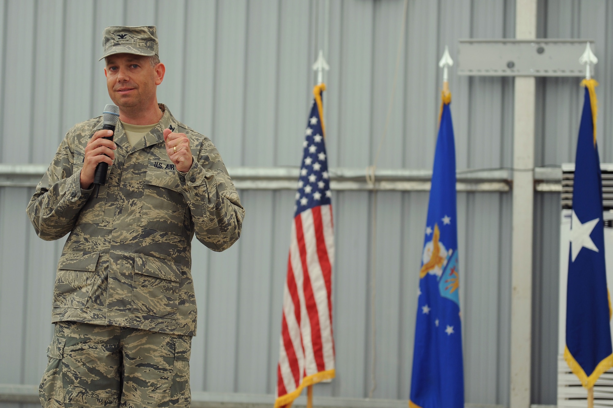 SOUTHWEST ASIA - Col. Eric Pierce, Commander, 380th Expeditionary Mission Support Group, makes his first speech to Airmen of the 380th EMSG and 380th Air Expeditionary Wing after accepting command during a ceremony, June 30 at an undisclosed location in Southwest Asia. Colonel Pierce comes from the Pentagon joining the 380th Air Expeditionary Wing to lead the 380th EMSG. (U.S. Air Force photo by Senior Airman Brian J. Ellis) (Released)