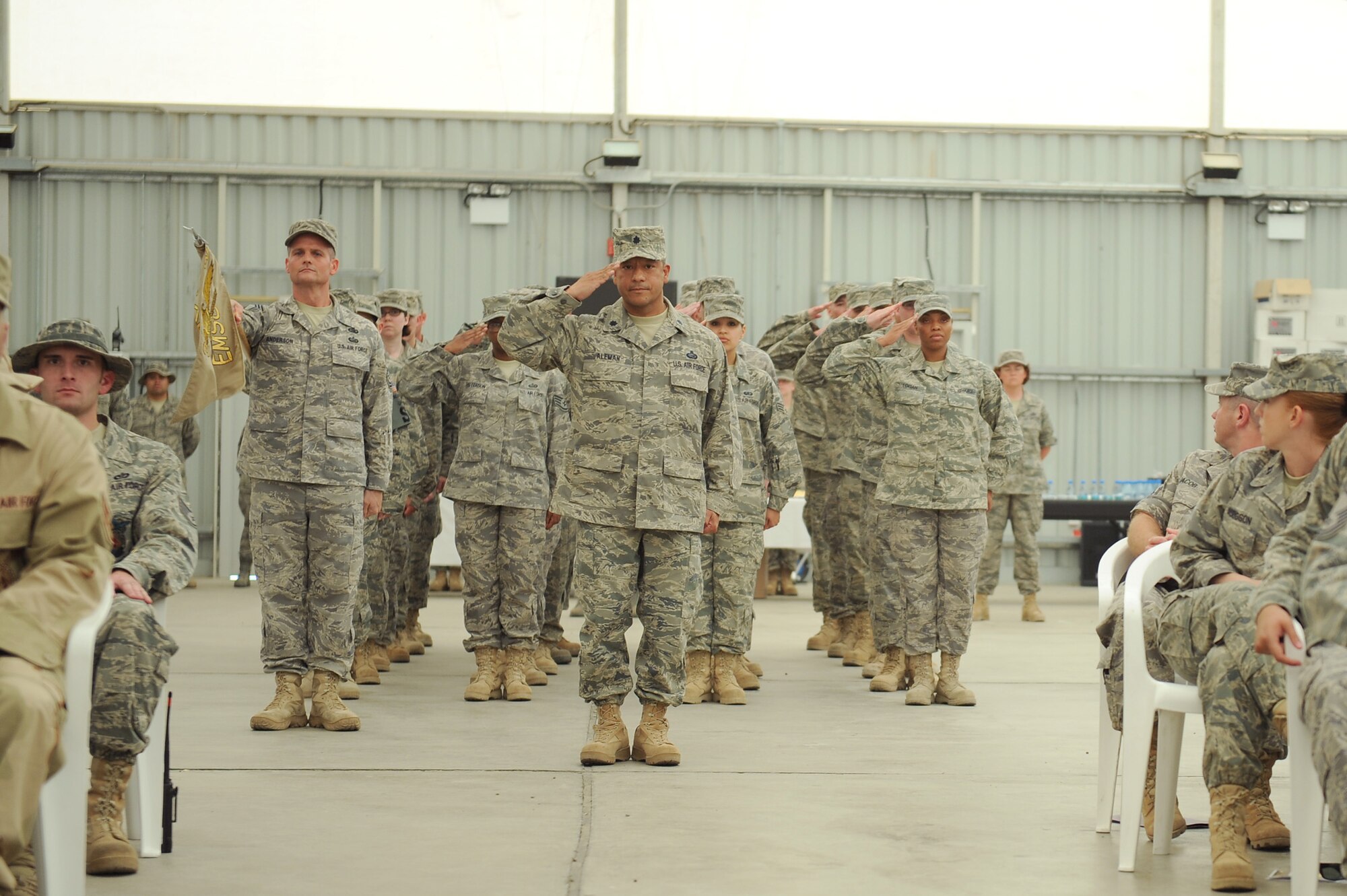 SOUTHWEST ASIA - Lt. Col Jose Aleman, 380th Expeditionary Mission Support Group, deputy commander, leads Airmen of the 380th EMSG in its first salute to their new commander, Col. Eric Pierce as he takes command, June 30 at an undisclosed location in Southwest Asia. Colonel Pierce comes from the Pentagon joining the 380th Air Expeditionary Wing to lead the 380th EMSG. (U.S. Air Force photo by Senior Airman Brian J. Ellis) (Released)