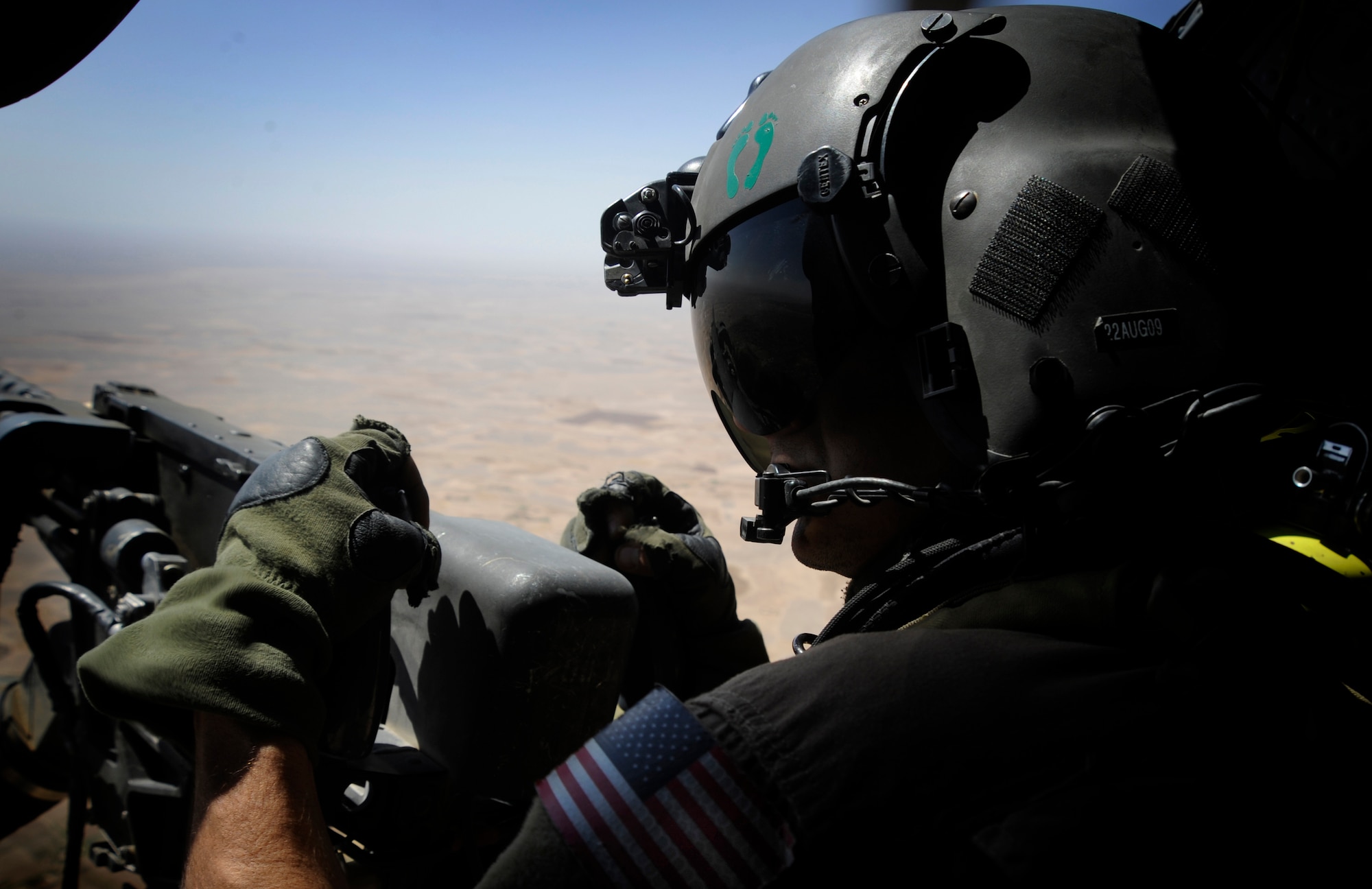 Staff Sgt. Sean Pellaton Aerial Gunner, 129th Exspeditionary Rescue Squadron provides security during a medevac mission, Hemland Province, Afghanistan, June 26, 2009. (U.S. Air Force Photo by Staff Sgt. Shawn Weismiller)