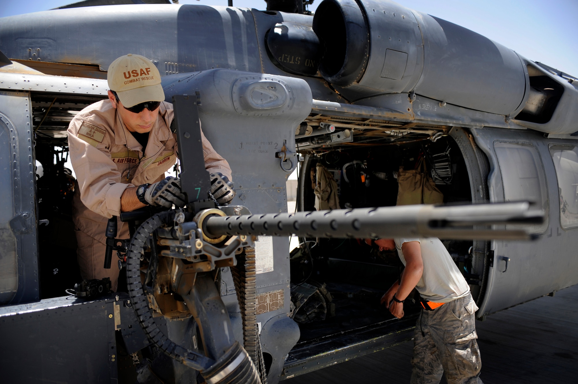 Senior Airman Adrian Jarrin, Aerial Gunner, 129th Expeditionary Squadron conducts a pre-flight inspection of a .50 caliber machine gun June 25, Camp Bastion, Afghanistan. (U.S. Air Force Photo by Staff Sgt. Shawn Weismiller)
 