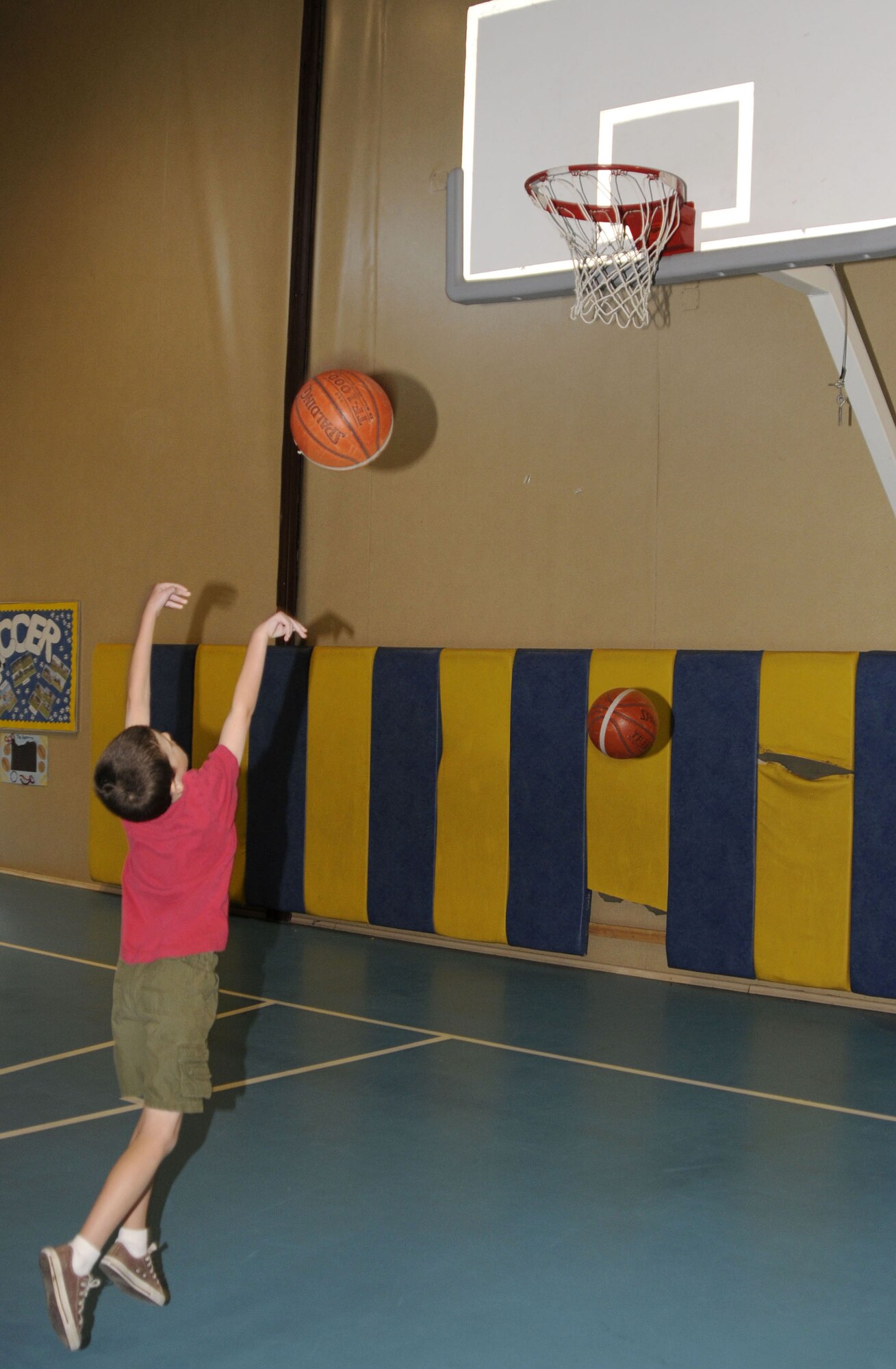 Liam McCammon, son of Capt. Shane McCammon, 39th Air Base Wing, practices his shot, Tuesday, July 1, 2009 during the basketball camp at Incirlik Air Base, Turkey. The camp, which ran the entire week, is one of several camps and recreation trips available for children during their summer. For more information about activities call YP at 676-6670. (U.S. Air Force photo/Airman 1st Class Amber Russell)