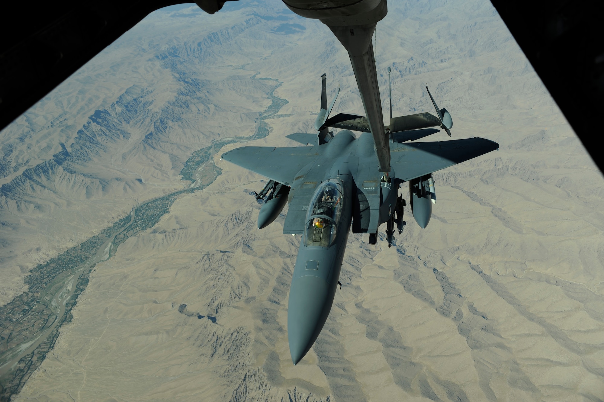 A U.S. Air Force F-15E Strike Eagle aircraft receives fuel from the aerial refueling boom of a KC-10 Extender aircraft from the 908th Expeditionary Air Refueling Squadron during combat operations June 17, 2009, over Afghanistan. (U.S. Air Force photo by Staff Sgt. Jason Robertson)