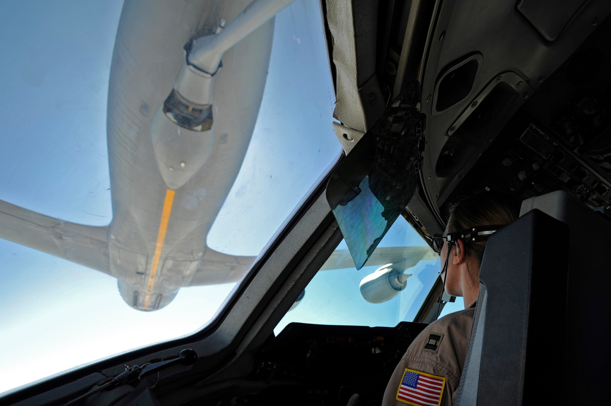 U.S. Air Force Capt. Kristin Sajevic pilots a KC-10 Extender aircraft, assigned to the 908th Expeditionary Air Refueling Squadron, while receiving fuel from an Air Force KC-135 Stratotanker June 14, 2009, over Afghanistan. (U.S. Air Force photo by Staff Sgt. Jason Robertson)