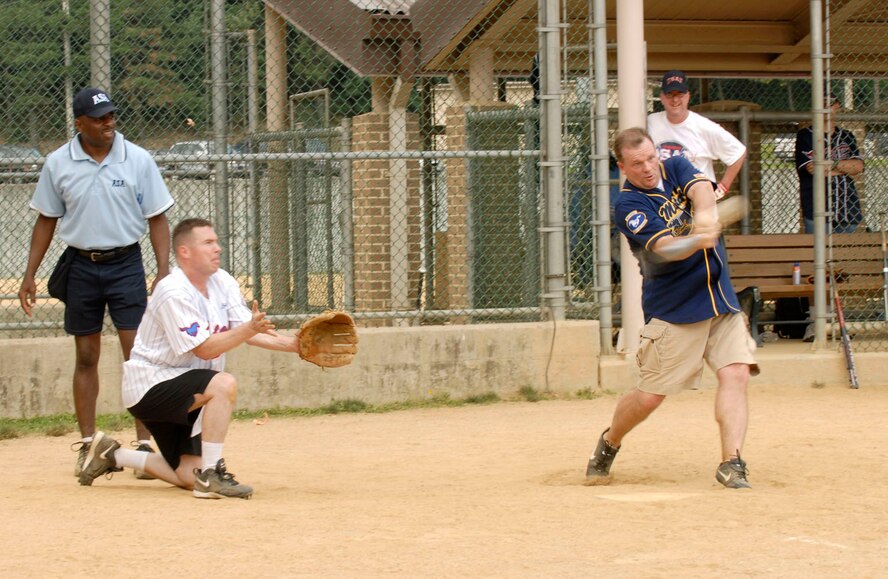 Col. Mark Mattison hits the ball for a home run in the Chiefs vs. the Eagles annual softball tournement July 1 at Osan Air Base, Republic of Korea. Colonel Mattison is the 51st Fighter Wing vice commander. (U.S. Photograph by Senior Airman Stephenie Wade)