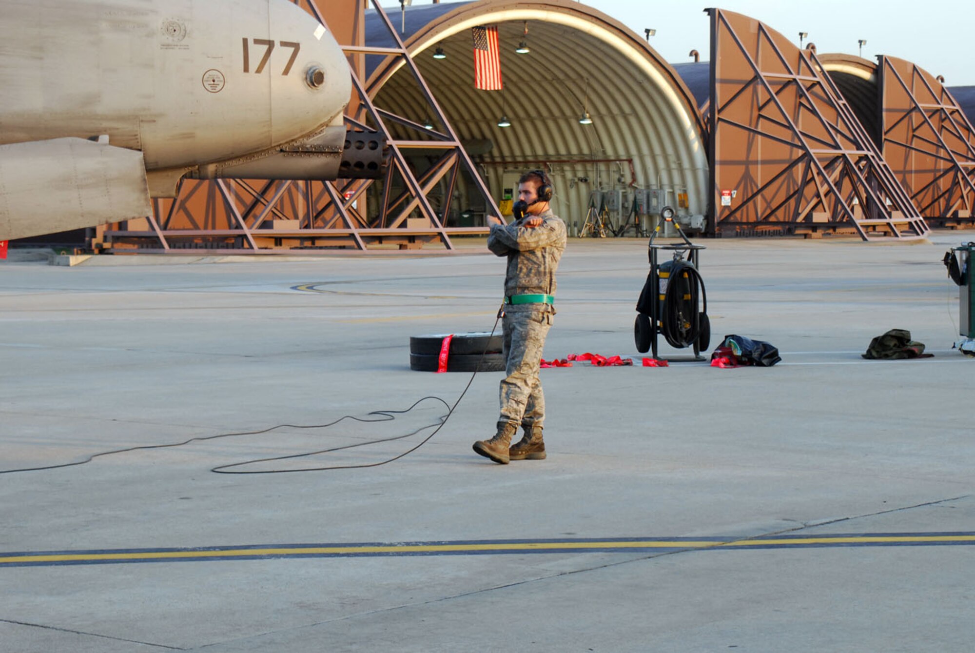 Airman 1st Class Matthew Henderson, 25th AMU assistant dedicated crew chief, prepares to launch a jet from the flightline here June 23. (U.S. Air Force photo/Staff Sgt. Terri Barriere)