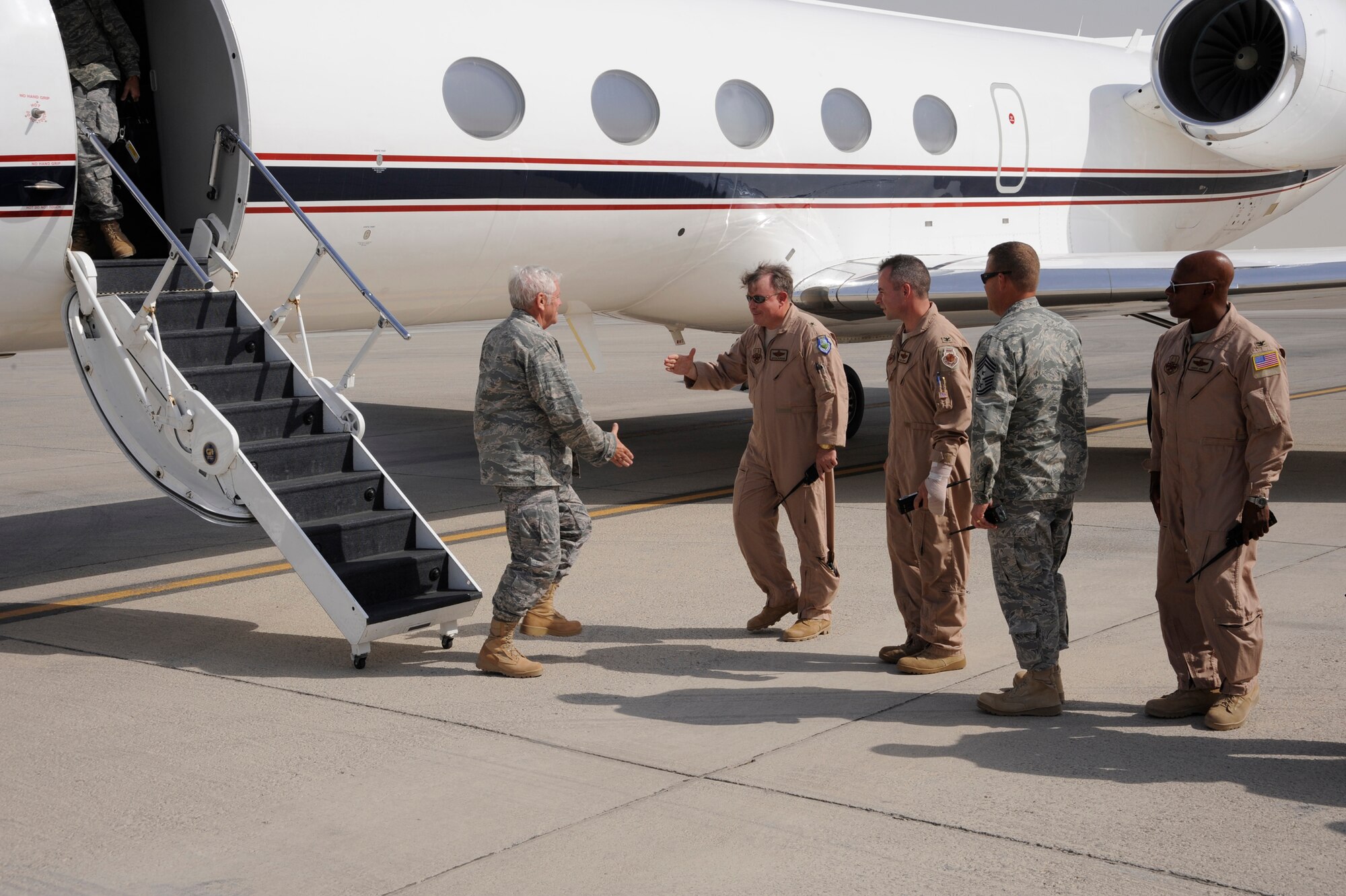 SOUTHWEST ASIA -- Gen. Art Lichte, Air Mobility Command Commander, is greeted by 380th Air Expeditionary Wing leadership at the beginning of his visit to the 380th. General Lichte took some time during a tour of the Central Command area of responsibility to visit with Airmen and talk about what AMC assets contribute to current overseas contingency operations. (U.S. Air Force Photo by Staff Sgt. Mike Andriacco) (Released)