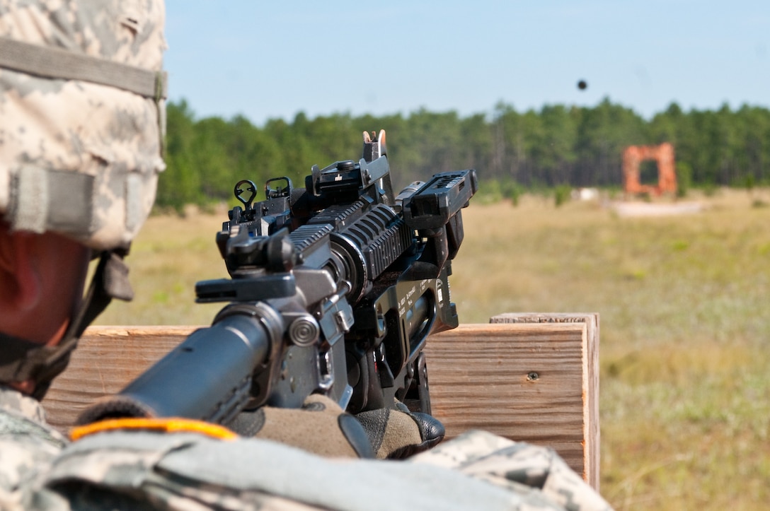 A U.S. Army paratrooper fires a training round from the new M320 ...