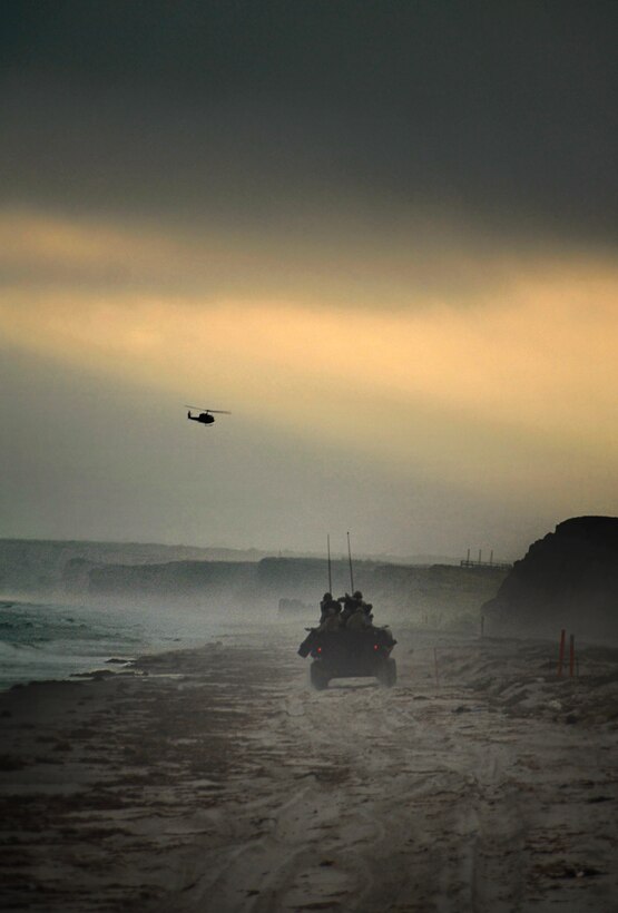 A 1st Light Armored Reconnaissance Battalion light-armored vehicle returns to its beachhead landing site here where it and other vehicles will board air-cushioned landing craft and head back to USS Bonhomme Richard. The Marines practiced the tactical recovery of a simulated missing pilot here July 2. The LAR detachment is part of Battalion Landing Team 2/4, the 11th Marine Expeditionary Unit’s ground combat element. The MEU, part of the Bonhomme Richard Amphibious Ready Group, is conducting its first pre-deployment exercise at sea with its Navy counterpart, Amphibious Squadron 7. The Navy and Marine Corps team is testing interoperability before a deployment certification exercise later this summer.