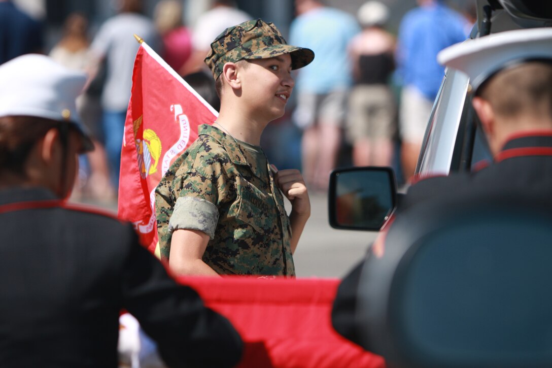 While inspecting the Mountain Warfare Training Center color guard, Alex Saldivar, a 14-year-old Bridgeport, Calif., native suffering from autism, bipolar disorder and attention deficit hyperactive disorder, walks tall in his crisp green uniform during Bridgeport's 147th Independence Day parade.